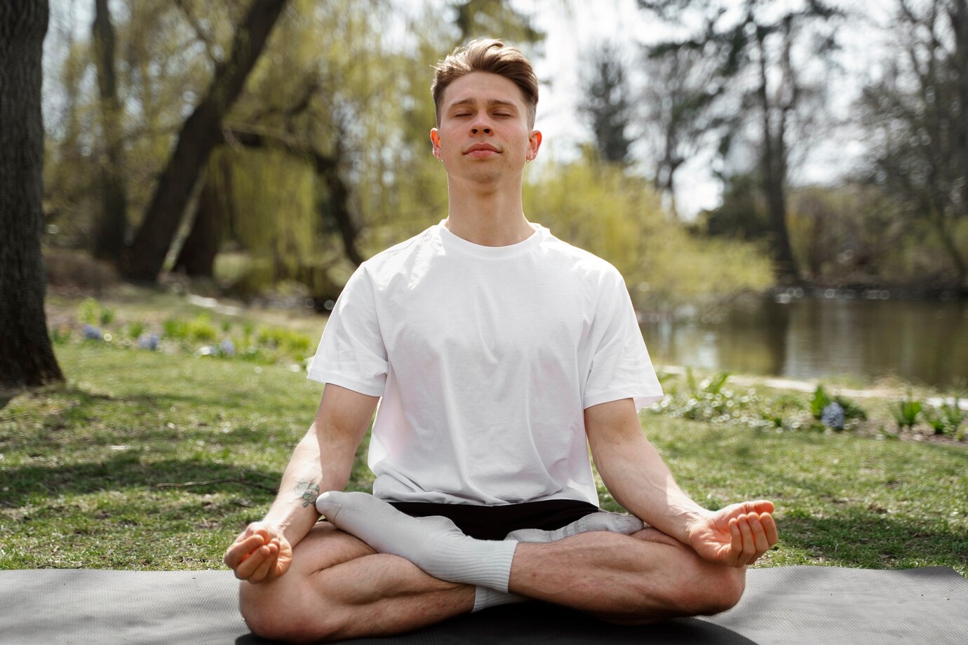 person practices yoga in a serene outdoor setting