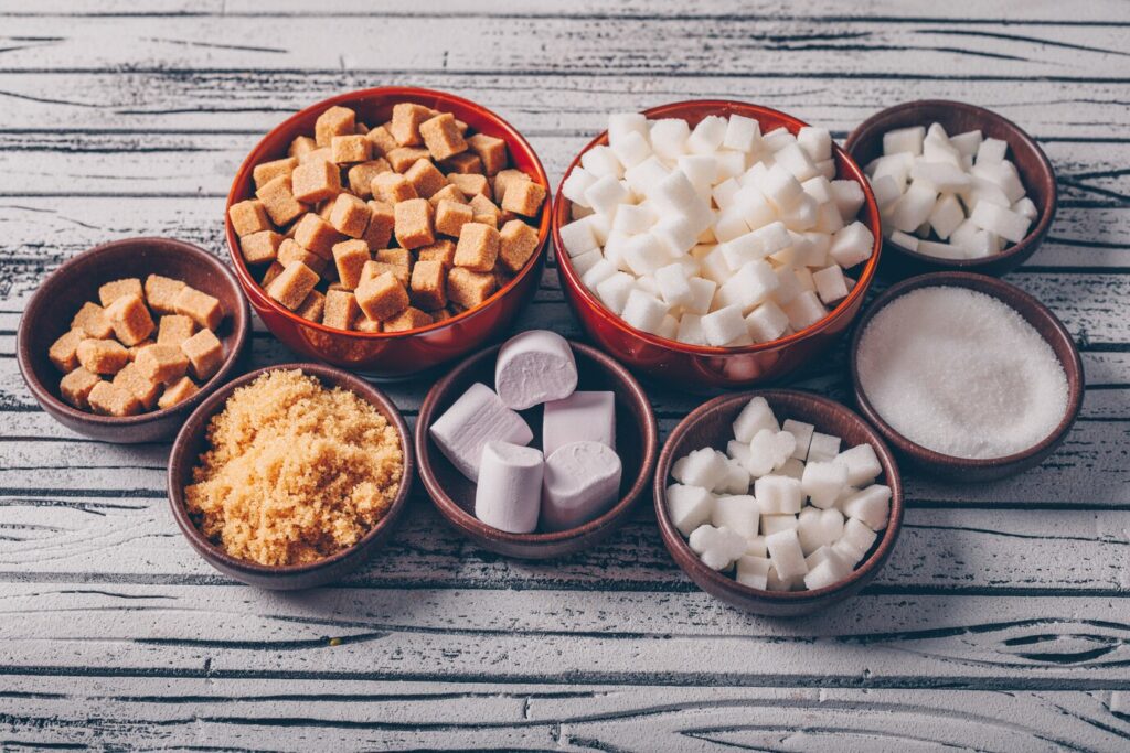 Assorted types of sugar displayed in various bowls